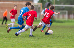Understanding Sever's Disease - image of boys playing soccer